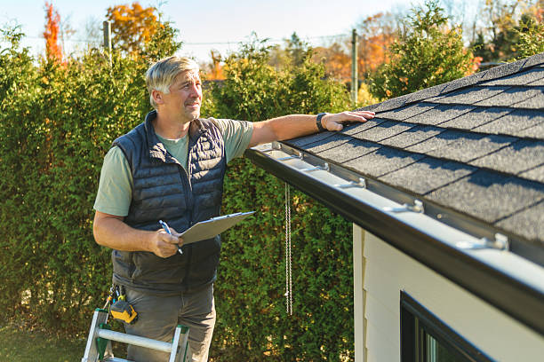 Professional Storm Damage Roof Repair technician working in Ayer, MA